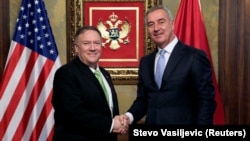 U.S. Secretary of State Mike Pompeo (left) shakes hands with Montenegrin President Milo Djukanovic during a meeting in Podgorica on October 4.