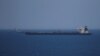 GIBRALTAR -- A British Royal Navy patrol vessel guards the oil supertanker Grace 1, that's on suspicion of carrying Iranian crude oil to Syria, as it sits anchored in waters of the British overseas territory of Gibraltar, historically claimed by Spain, Ju