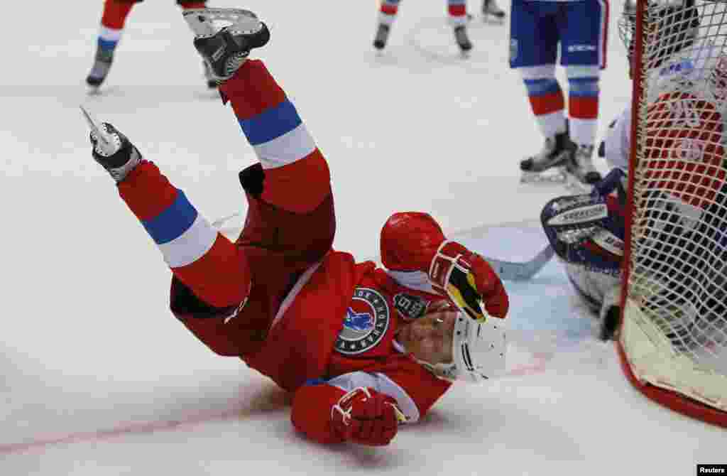 Russian President Vladimir Putin takes part in a gala match of the hockey teams of the Night League in Sochi on May 10. (Reuters/Yury Kochetkov)