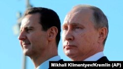 Президент Сирии Башар Асад (слева) и президент России Владимир Путин.