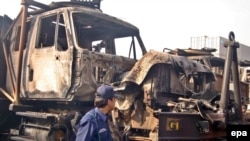 Torched trucks destined for NATO forces in Afghanistan from a previous insurgent attack in Peshawar