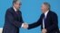 Kazakhstan's then-interim President Qasym-Zhomart Toqaev (left) shakes hands with former President Nursultan Nazarbaev in Nur-Sultan in April 2019.