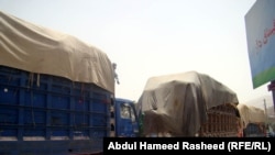 Heavily laden trucks line the highway outside the Afghan capital, Kabul.