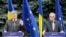 Ukrainian President Petro Poroshenko (left) and European Commission President Jean-Claude Juncker attend a joint news conference following the opening of the EU-Ukraine summit in Kyiv on July 13. 