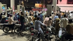People in Karachi, Pakistan, waiting to buy gas, as fuel prices rise, on April 2