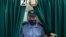 A police officer leaves a voting booth during early voting for the presidential election in the town of Hlybokaye, north of Minsk, on August 4.