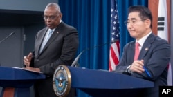 U.S. Defense Secretary Lloyd Austin (left) speaks during a joint press briefing with South Korean Defense Minister Kim Yong-hyun at the Pentagon on October 30. 