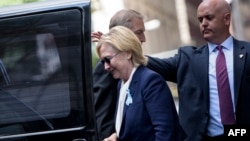 Хиллари Клинтон, покинув церемонию памяти жертв терактов 11 сентября 2001 года, пошатнулась, садясь в машину 