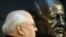 Mikhail Gorbachev stands next to a bust of himself after unveiling it in Berlin in November 2009.