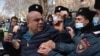 Armenian police detain a protester during a February rally in Yerevan to demand the resignation of the prime minister, who they say mishandled the war with Azerbaijan.