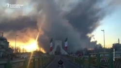 Tehran's Landmark Azadi Tower Seen Surrounded By Smoke And Flames