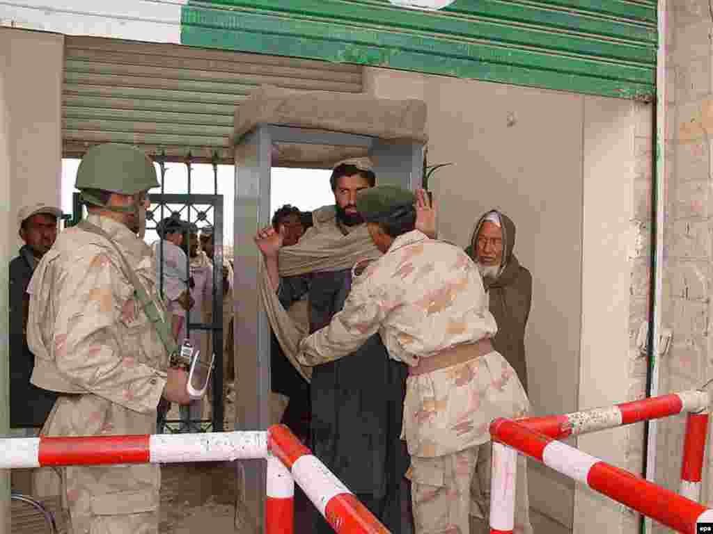 A Pakistani paramilitary troop frisks a Pashtun tribesman as he crosses the border - But in fact, mutual relations have been strained from the start, when Afghanistan voted against nascent Pakistan's United Nations membership over Kabul's refusal to recognize the so-called Durand Line, which demarcated British colonial India. No Afghan government has ever recognized the legitimacy of that 19th-century border. 