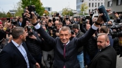 Czech Prime Minister Andrej Babis gestures in Prague as he reacts to early results from the parliamentary elections that his ANO party won in October 2025.