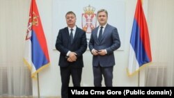 Ministri Budimir Aleksić i Nikola Selaković, bez državne zastave Crne Gore u pozadini