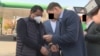 Raimbek Matraimov (left) is shown as he was detained in Bishkek on October 20.