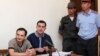 Armenia -- Opposition activist Tigran Arakelian (L) on trial in Yerevan, 9Aug2013.