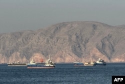 Vessels are seen anchored in the Strait of Hormuz in May.