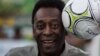 Brazil -- Legendary Brazilian former football player Pele poses with a ball during the inauguration ceremony of the new technology football pitch installed at Mineira favela in Rio de Janeiro, September 10, 2014