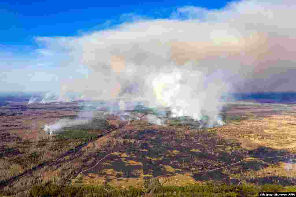 This aerial picture taken on April 12 shows a forest fire burning in the 30-kilometer Chernobyl exclusion zone.