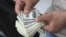 Iran -- A street money exchanger counts US dollars in downtown Tehran, 09Jun2011