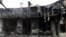 A burnt-out building, apparently a bus station in Sanandaj, Western Iran. November 18, 2019