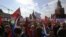 Thousands of members of Russian trade unions marched through Moscow on May to mark International Workers' Day. They held signs representing their unions and, frequently, praising President Vladimir Putin.