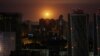 An explosion is seen in the sky over Kyiv during a Russian drone and missile strike on May 29.