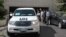 A convoy of United Nations vehicles leaves a hotel in Damascus on August 28 carrying UN inspectors traveling to a site in the Syrian capital of alleged chemical weapons attacks.
