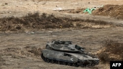 An Israeli Army main battle tank is deployed at a position along the border with Lebanon in northern Israel on October 1.