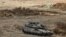 An Israeli Army main battle tank is deployed at a position along the border with Lebanon in northern Israel on October 1.
