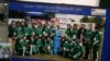 A group photo of a soccer team that includes Shahida Raza is displayed for the media at her home in Quetta.