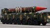 A Pakistani-made Shaheen-III missile, which is capable of carrying nuclear warheads, is carried on a trailer during a military parade in connection with Pakistan National Day celebrations in Islamabad in March 2021.