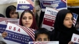 Afghan refugees rally in Islamabad after Washington suspended the U.S. Refugee Admission Program, on January 24.