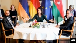 Germany - German Foreign Minister Annalena Baerbock welcomes Armenia's Foreign Minister Ararat Mirzoyan, left, and Azerbaijan's Foreign Minister Jeyhun Bayramov for peace talks in the Villa Borsig in Berlin, February 28, 2024.