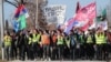 Students hold flags of Serbia and their university departments as they walk to a protest in Kragujevac, Serbia, on February 15. 