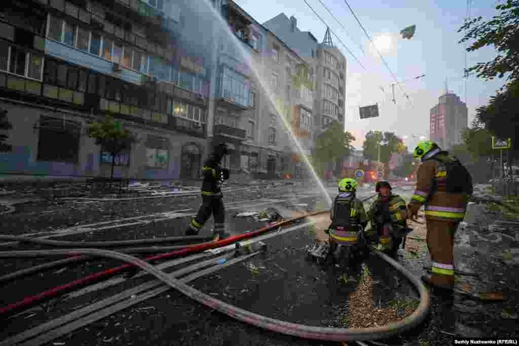Firefighters battle a blaze at dawn in Kyiv. Trump says he is looking "very strongly" at potential sanctions against Russia as diplomatic efforts to end the war appear increasingly fruitless.