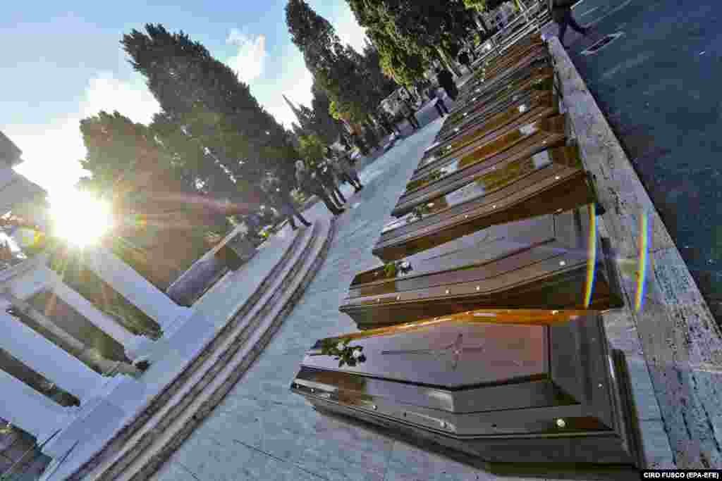 The funeral of 26 young female migrants in the Monumental Cemetery of Salerno, Italy. The bodies of the victims were recovered from the Mediterranean Sea by the Spanish ship Cantabria on November 5. (epa-EFE/Ciro Fusco)