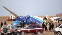 Emergency specialists work at the crash site of an Azerbaijan Airlines passenger jet near the western Kazakh city of Aqtau on December 25. 