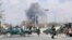 Security forces guard the area as smoke billows from the Sardar Daud Khan's Hospital, also known as Kabul Military Hospital, during an attack by suspected militants in Kabul on March 8.