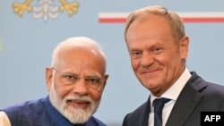 Polish Prime Minister Donald Tusk (R) and Indian Prime Minister Narendra Modi pose for a photo after addressing a press conference after talks at the Polish Prime Minister's Office in Warsaw, Poland on August 22, 2024.