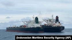 The Iranian-flagged MT Horse (left) and Panamanian-flagged MT Frea tankers are seen anchored together in Pontianak waters off Borneo island on January 24.