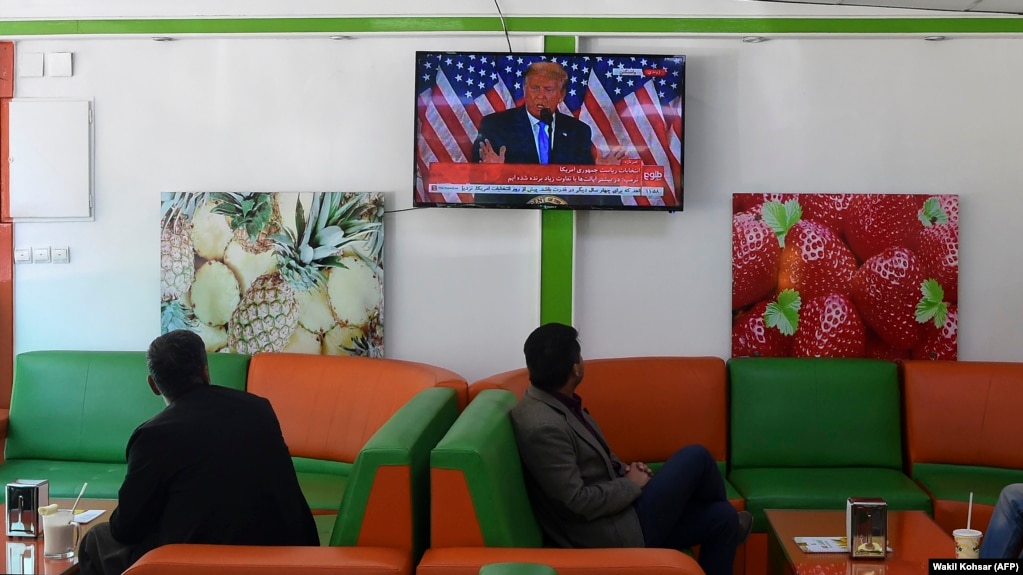 Customers watch a live broadcast of Donald Trump at a juice shop in Kabul. (file photo)