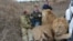 CRIMEA -- Oleg Zubkov and lions Chuk and Gek in the Crimean “savannah” of the Taigan Lion Park. Crimea, Ukraine, 2017
