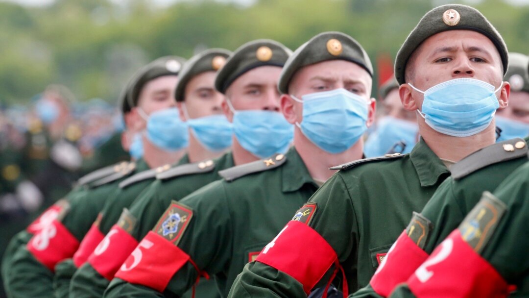 Russian soldiers wearing protective face masks take part in a Victory Day parade rehearsal at a military airfield near Rostov-on-Don on June 4.