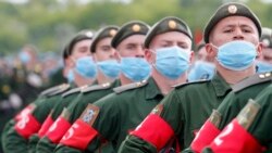 Russian soldiers wearing protective face masks take part in a Victory Day parade rehearsal at a military airfield near Rostov-on-Don on June 4.