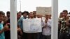 Vendors in the city of Qom gathering in front of governor's office in protest to death of a vendor, on Sunday August 13, 2017.