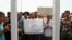 Vendors in the city of Qom gathering in front of governor's office in protest to death of a vendor, on Sunday August 13, 2017.