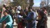 Pakistani Christians are evacuated by security personnel from a Methodist church after a suicide bomber attacked during a Sunday service in Quetta on December 17.