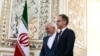 Iran's Foreign Minister Mohammad Javad Zarif (L) receives his German counterpart Heiko Maas in the capital Tehran on June 10, 2019. (Photo by ATTA KENARE / AFP)