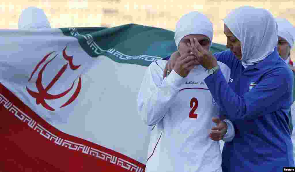 Iranian women&#39;s national soccer team players react after withdrawing from a qualifying match against Jordan for the 2012 London Olympic Games in Amman in June 2011 over FIFA&#39;s rules on head coverings.